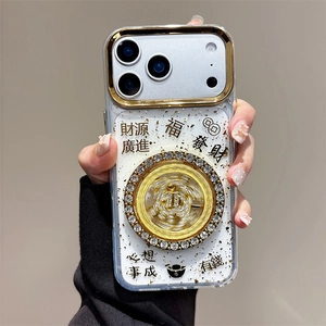 Détail de la molette rotative en strass et motifs dorés sur coque iPhone transparente