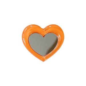 Orange heart-shaped collapsible phone socket mirror with glossy resin frame and shiny finish