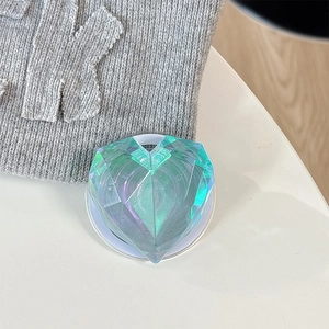 Detail of laser-cut heart magnetic phone grip with iridescent holographic finish
