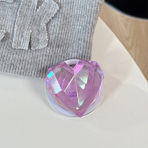 Macro detail of purple 3D laser heart phone grip with multi-faceted gem cut design