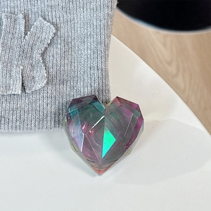 Macro shot of 3D geometric laser heart phone grip with colorful holographic gradient