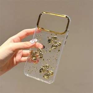 Custodia trasparente per iPhone con dettagli in foglia d'oro e decorazioni a fiocco 3D