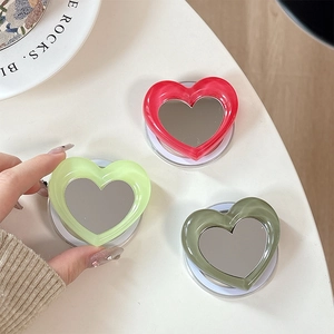 Minimalist heart-shaped magnetic phone grip and mirror in red and green glossy finish