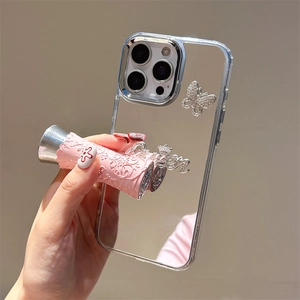 Mirror iPhone case with rhinestones butterfly and crown pendant showing reflection