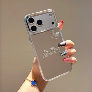 Close-up of mirror phone case for iPhone featuring rhinestone butterfly and Queen lettering