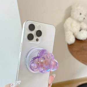 Close-up of holographic cloud phone grip with MagSafe magnetic base on white smartphone