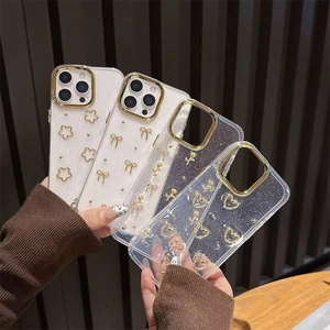Glittering iPhone cases with golden flowers and 3D bows, showing full camera protection