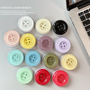 Colorful button-style expandable phone grip stands in various vibrant candy colors