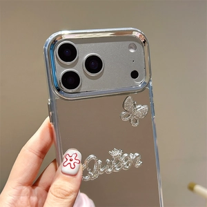 Detail of silver mirror phone case with rhinestone butterfly and Queen text for iPhone