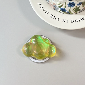 Detail of laser green cloud phone grip showing iridescent finish and expandable base