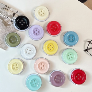 Colorful button-style expandable phone grip socket set with various candy colors