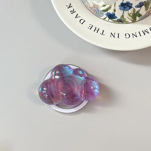 Close-up of holographic cloud phone grip with iridescent purple finish and stable pop socket