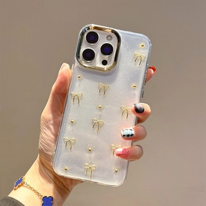 Clear glitter phone case for iPhone with 3D gold bow and metallic bead decorations