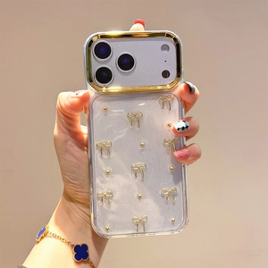 Detail of transparent iPhone case with gold bows, beads, and glitter for 16 Pro Max