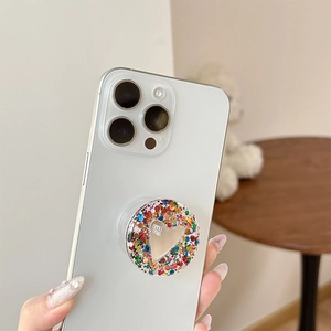 Sparkly heart shaped phone grip with pink glitter and silver mirror finish for smartphones