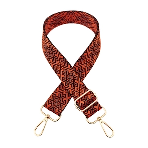 Ethnic style bag strap with orange and black geometric pattern and gold hardware