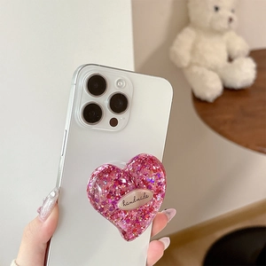 Supporto per cellulare a forma di cuore glitterato con placchetta metallica handmade