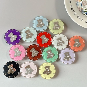Close-up of assorted rhinestone bear phone grips in 13 vibrant acrylic colors