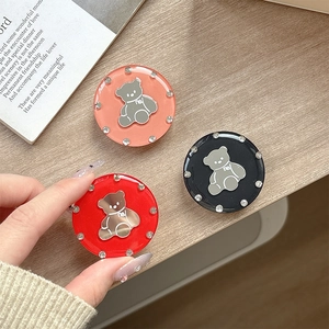 Sparkly rhinestone bear phone socket mirror stand in red, coral, and black colors