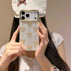Detailed view of the gold heart pattern and glitter finish on a transparent phone case