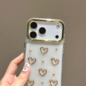 Detail of glitter gold heart phone case for iPhone 16 with raised floral heart patterns
