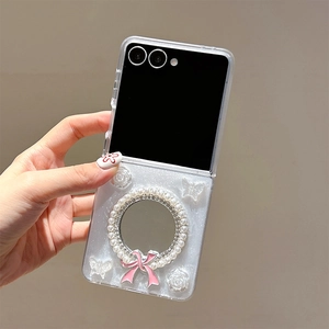 Detail of Galaxy Z Flip case with mini mirror, pearl rhinestone frame and pink ribbon bow