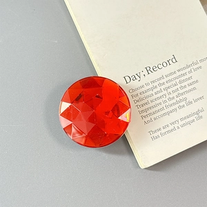 Detail of red faceted crystal phone socket grip with luxury dopamine style design