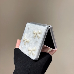 Detail of white glitter phone case with 3D bows and pearls for Samsung Z Flip