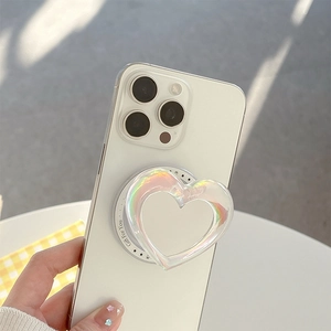 Iridescent heart-shaped phone grip on a smartphone with Gift For You decorative text