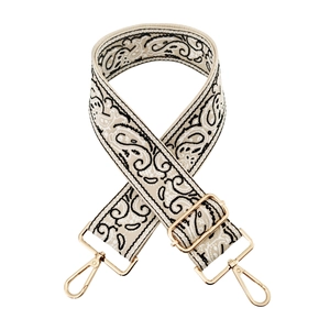 Detailed embroidery of paisley patterns on woven bag strap with golden metal lobster hooks