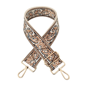 Close-up of woven paisley pattern strap with polished gold-tone lobster clasps