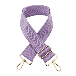 Detail of purple herringbone woven bag strap with adjustable gold-tone metal hardware