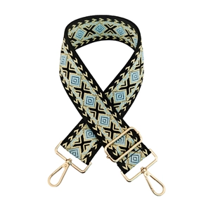 Detailed view of 5cm ethnic diamond jacquard bag strap with golden lobster clasps