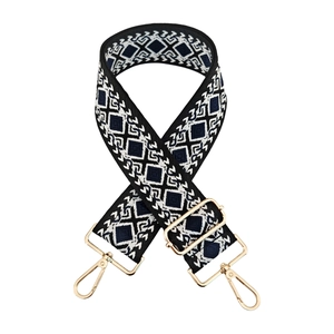 Close-up of geometric diamond pattern on thick ethnic jacquard strap with gold metal hooks