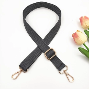 Adjustable black shoulder strap with geometric weave and gold lobster clasps