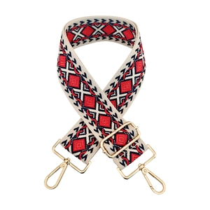 Close-up of geometric diamond embroidery on ethnic style strap with gold metal hardware