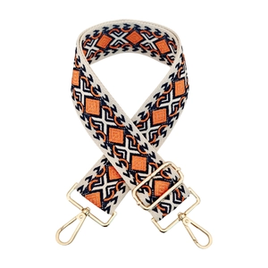 Close-up of bohemian diamond pattern woven strap with premium gold metal clasps