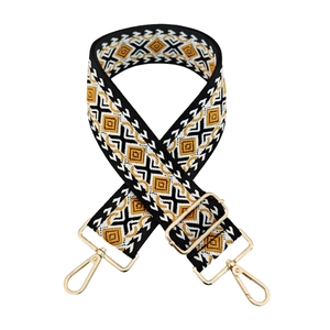 Close-up of geometric pattern strap with adjustable metal buckles and lobster clasps