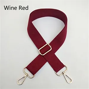 Detail of adjustable wine red canvas shoulder strap with gold metal lobster clasps