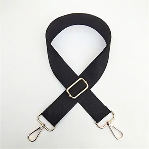 Adjustable black cotton canvas shoulder strap with gold metal hooks for handbags