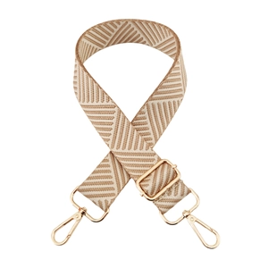 Detail of adjustable wide woven shoulder strap with beige chevron pattern and gold metal hooks