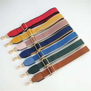 Detail of multi-color adjustable nylon shoulder straps with gold-tone rotating metal buckles