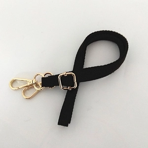 Adjustable black slim shoulder strap with golden metal lobster claws and swivel hooks