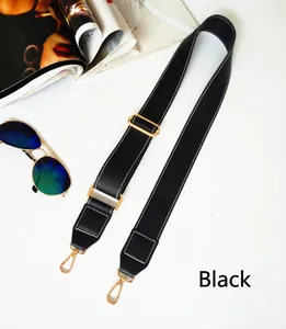 Adjustable black PU leather bag strap with white stitching and gold lobster clasps