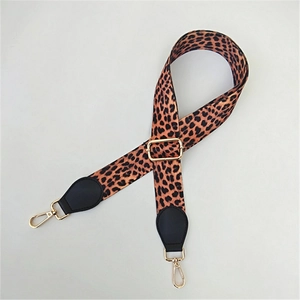 Adjustable leopard print bag strap with golden metal clasps and black faux leather ends