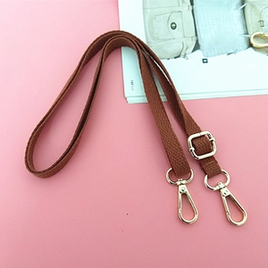 Adjustable brown canvas replacement bag strap with golden metal lobster clasps