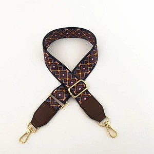 Detail of adjustable geometric weave strap with high-quality gold metal hooks
