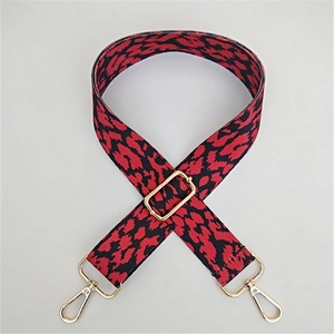 Adjustable red and black leopard print wide bag strap with gold metal hardware hooks