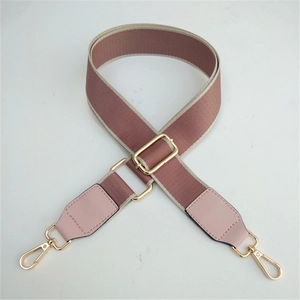 Adjustable wide woven bag strap in dusty rose and beige with gold metal hooks