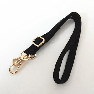 Adjustable black nylon shoulder strap with gold metal lobster clasps for crossbody bags
